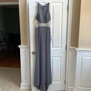 Long glittery gown. Sleeveless racer back style with beaded waistline